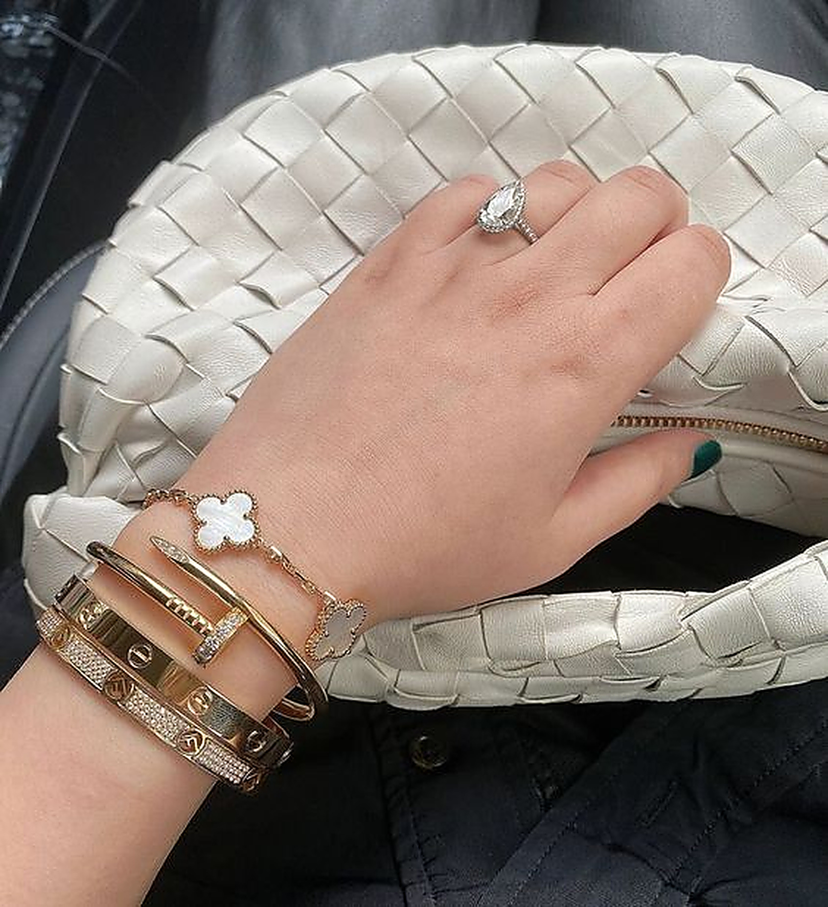 Stacked bracelets and rings styled on the wrist